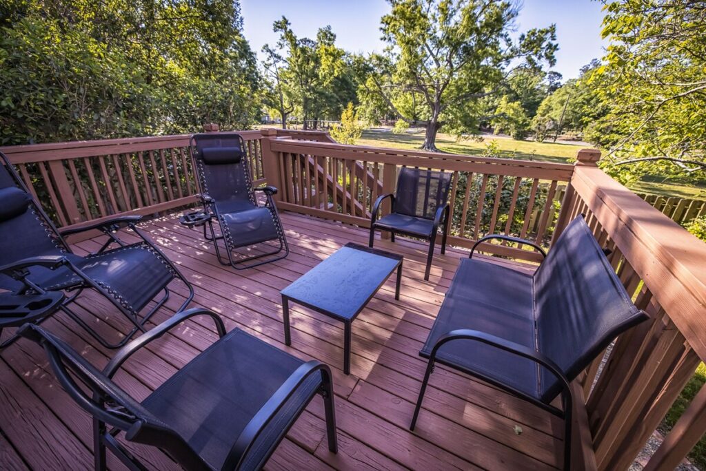 outdoor wooden patio with chairs Wilmington Vacation Homes